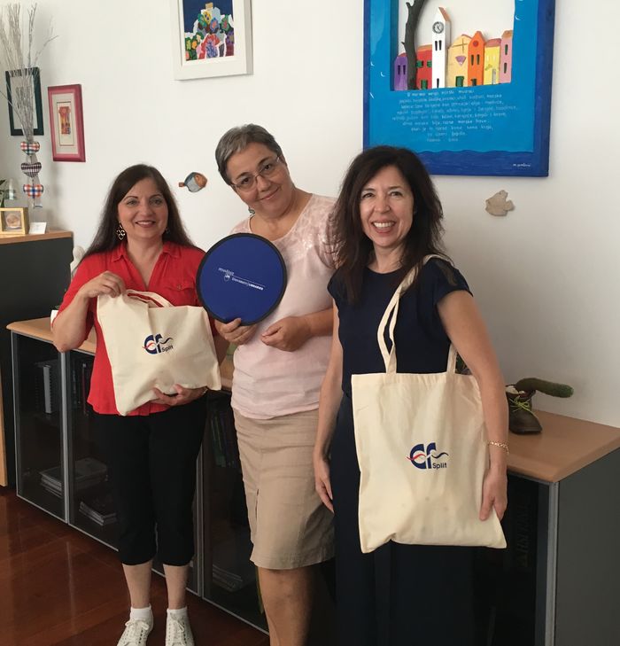 Two Berks Professors exchange gifts with the dean of the faculty of economics at the University of Split 