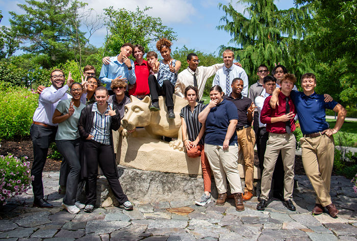 LION STEM Scholars pose for a photo with the Berks Lion Shrine.