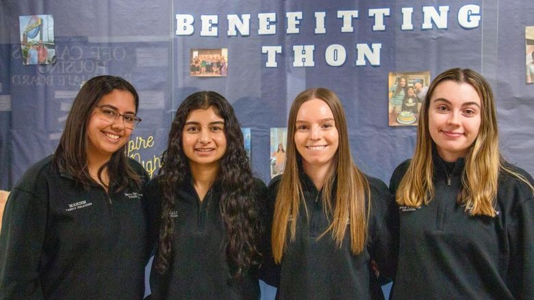 Four female Berks students smile for the camera