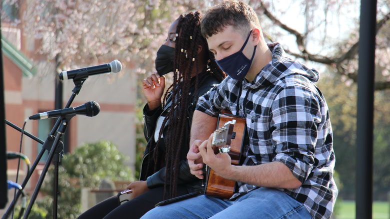 Two students perform on stage at SpringFest, a musical event hosted by Berks Residence Life on April 23.