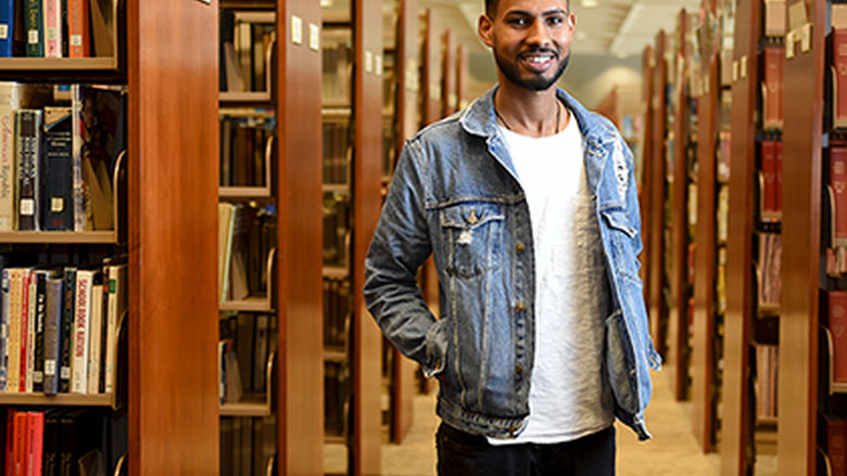 Tesfay Rezene in the library at Penn State Berks