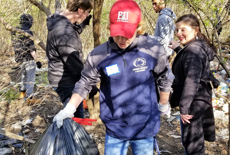 Students help cleanup park trails.