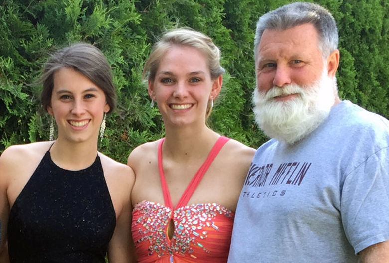 Two female Penn State Berks graduates with their father.
