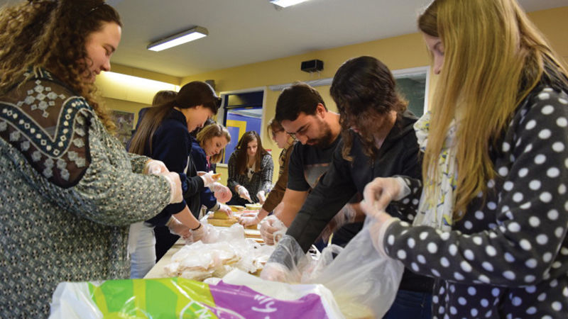 Penn State Berks students formed an assembly line to make as many sandwiches for the homeless as possible between sessions.