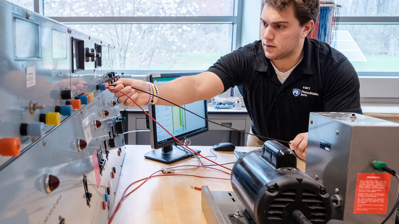 An engineering student works in one of the campus's electrical engineering labs