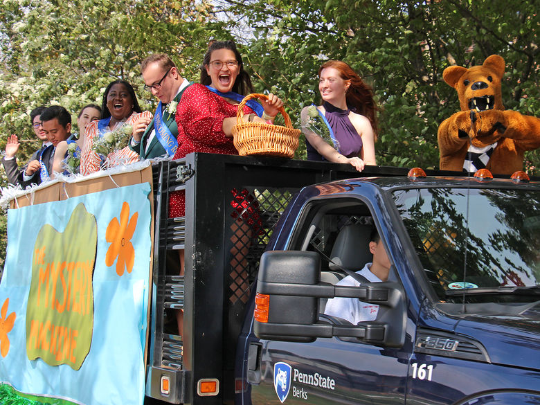 Homecoming court during the Homecoming Parade with the Nittany Lion