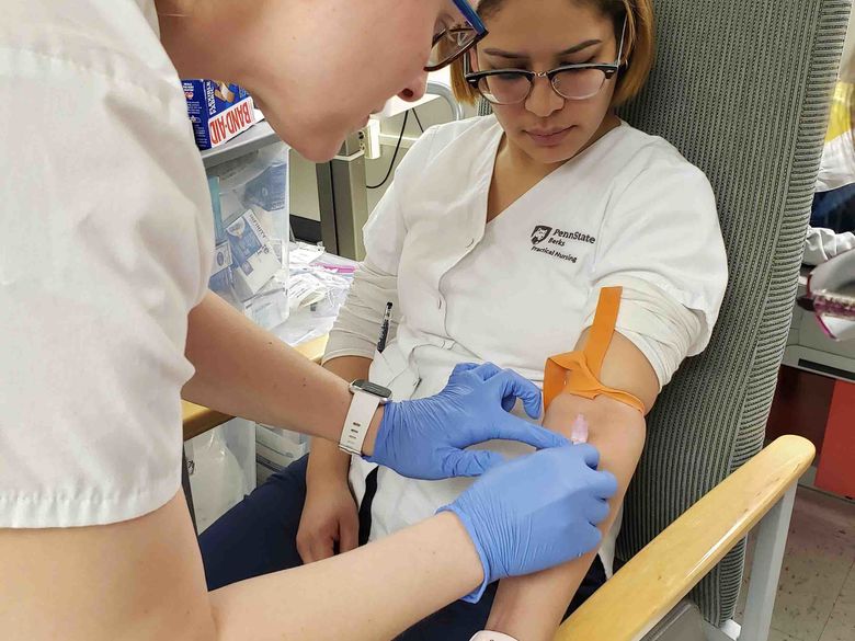 Photo of Berks Practical Nursing Students in Clinical Simulation Lab Setting