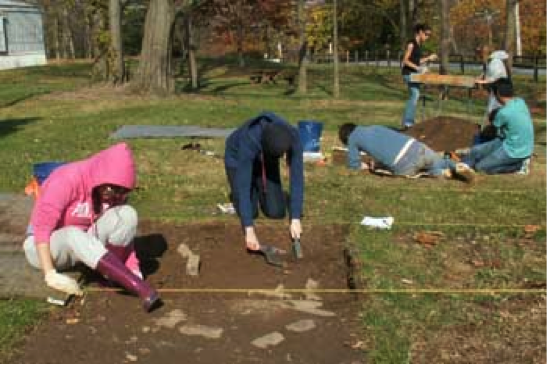 Students digging up historic artifacts