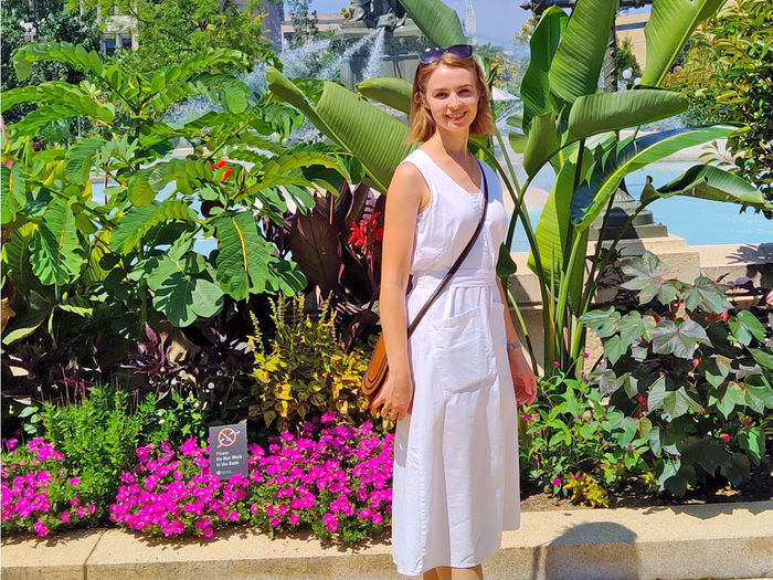 Photo of student Elizabeth Geynovich in front of plants.