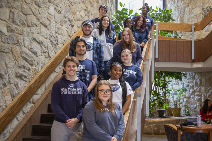 resident assistants for the villages line up along the Perkins Student Center stairs