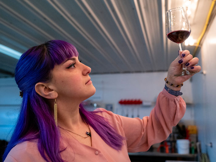 Kat examining the wine