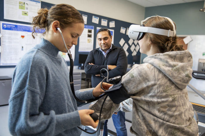 Diana Stoltzfus, left, takes baseline measurements of her study participant.