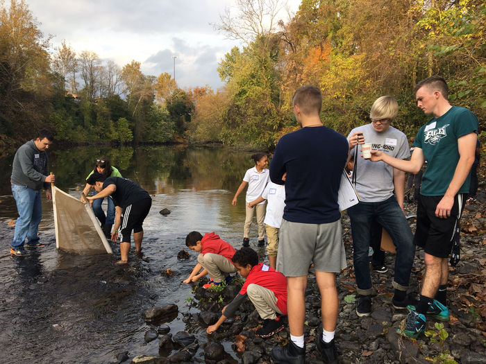 Berks students and Olivet Club children testing water quality.