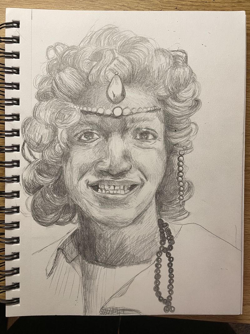 a pencil drawing of a smiling young person
