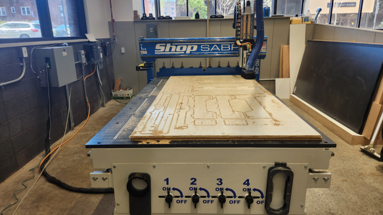 A CNC router cutting out a sleeping platform prototype