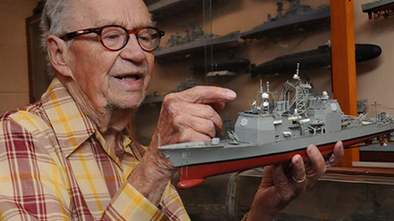 Ed Wiswesser pictured with a model train.
