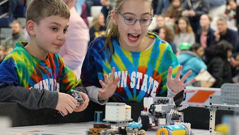 Smart Software team members Ryan Avram and Caylyn Hauser present their robot during the tournament.