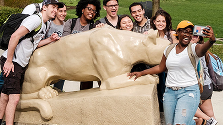 Berks students take a selfie in front of the Lion shrine