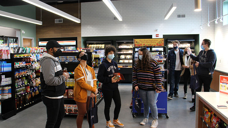 Student inside the newly open Creekside Market at Penn State Berks.