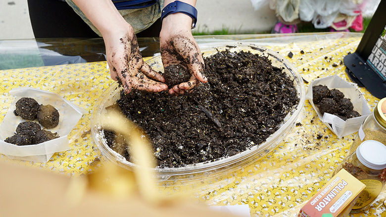 Community members making seed bombs for Earth Day 2019.