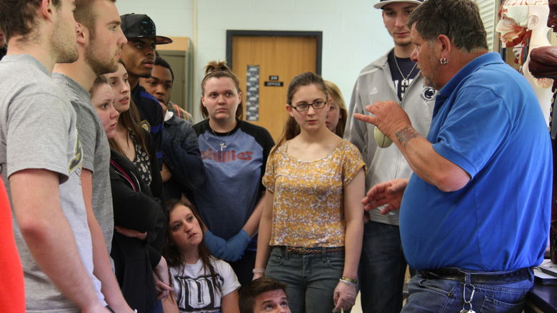 Students gather around John Long
