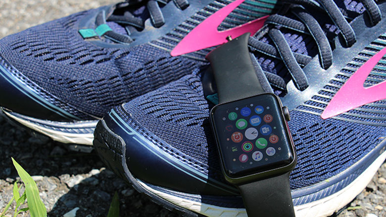 An Apple Watch and a pair of running shoes
