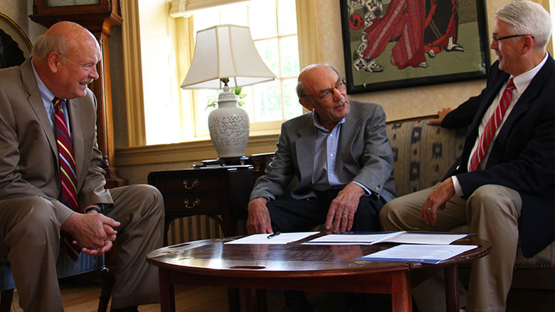 Rolf Schmidt (center) discusses the scholarship with Chancellor R. Keith Hillkirk (left) and David Delozier, Director of Development and Alumni Relations. 