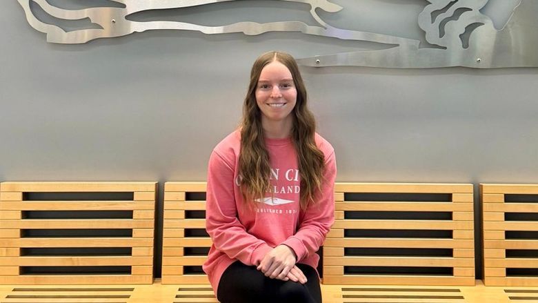 Photo of Sydney Bankert sitting in Gaige Building