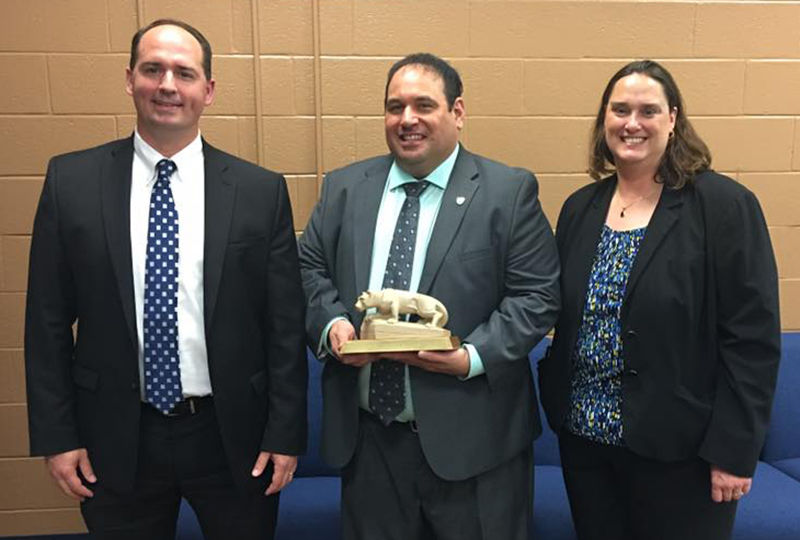 Jonathan Kukta (center) was recently honored with Penn State Schuylkill's Outstanding Alumnus Award. 