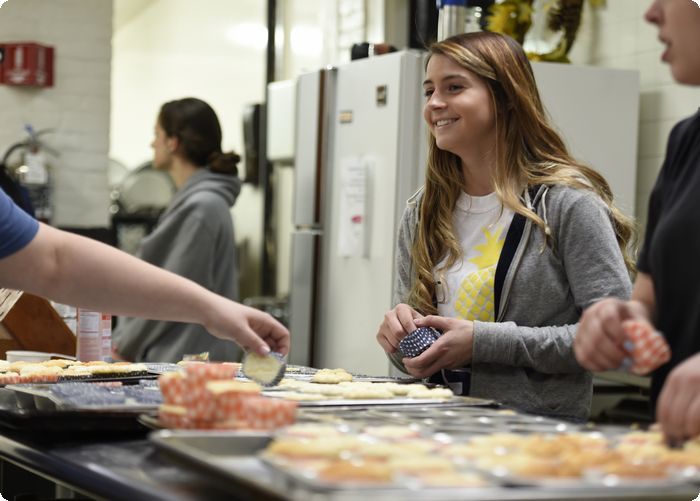 Penn State Berks students prepare and serve a multiple course meal for residents at the Opportunity House.