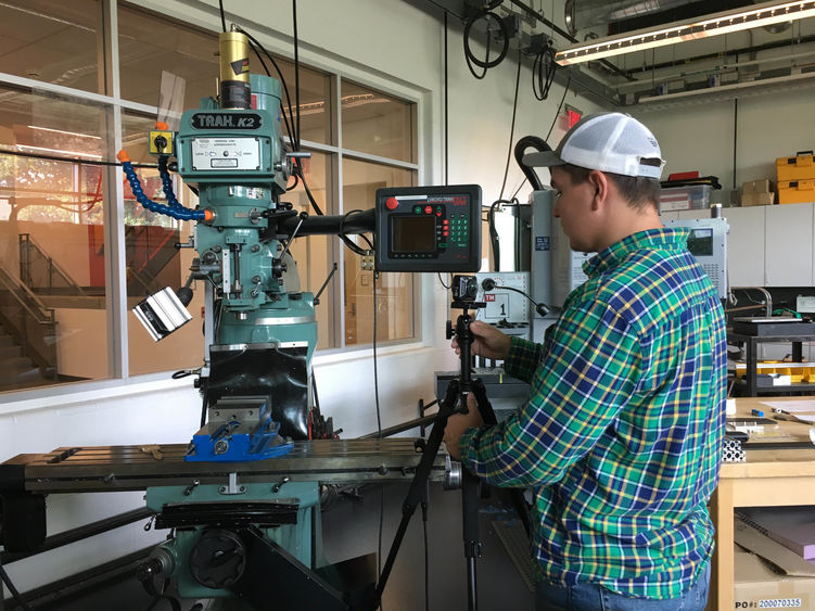 Wyatt Ritchie works on capturing machine shop equipment
