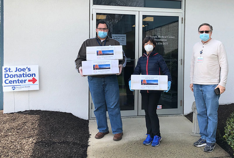 Hongyan “Red” Yuan delivers 1,200 surgical masks to Penn State Health St. Joseph.