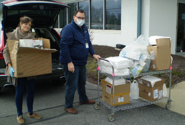 Lisa Weaver transferring a large donation of medical supplies.