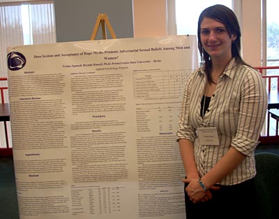 Female student and her research poster