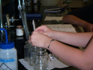 girl working with beakers in lab
